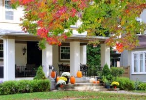 MUM, PUMPKINSD ON PORCH STAIRS